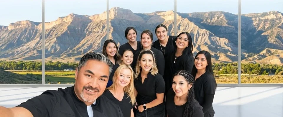 Dr. Siona with the Ohana team, with Western Colorado mountains in the background